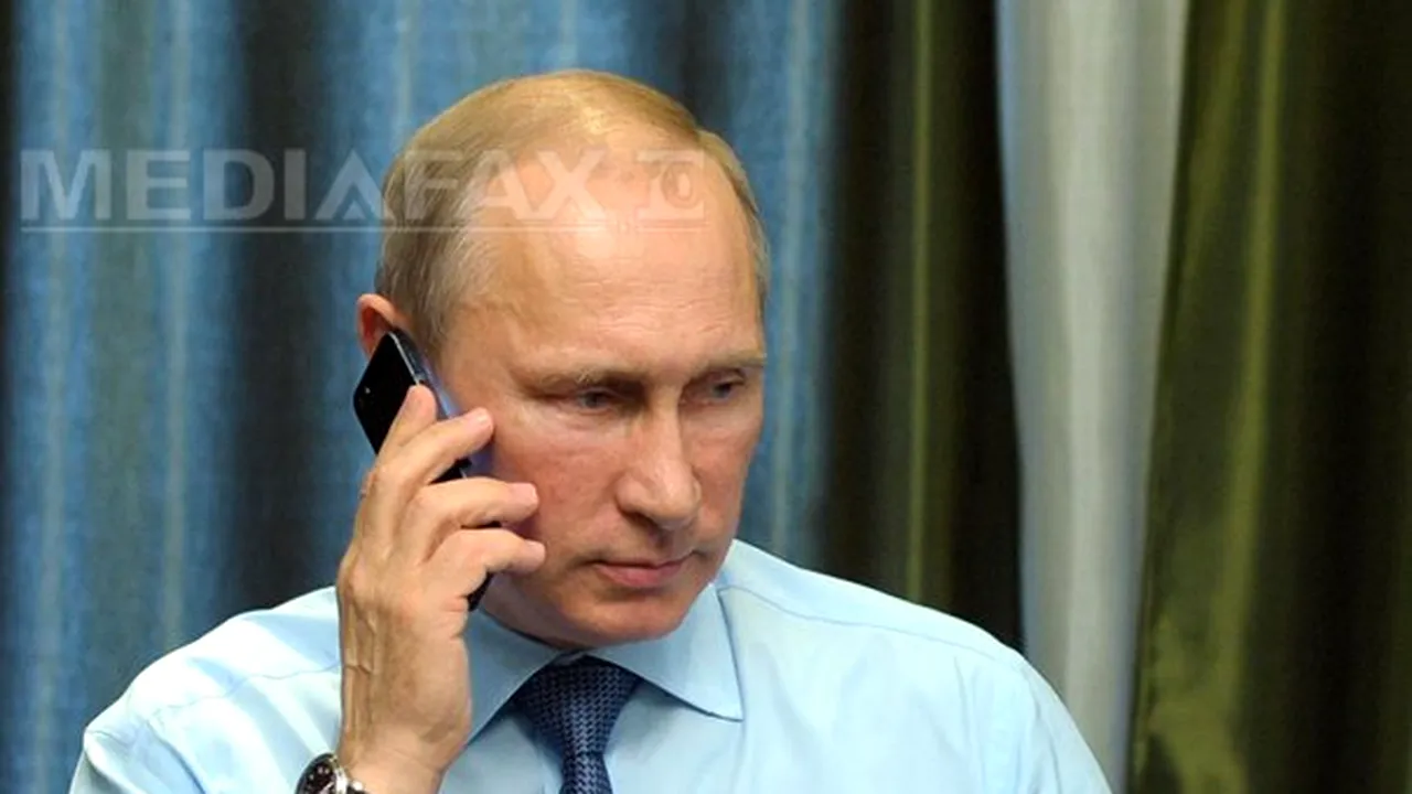Putin şi Abbott discută despre 