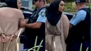 VIDEO O femeie din Australia a fost arestată pentru că a tuşit şi l-a scuipat pe un ofiţer
