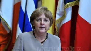 Merkel a cedat teren: Liderii UE înlesnesc condiţiile finanţării de criză pentru Spania şi Italia