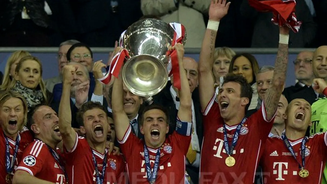 FINALA LIGII CAMPIONILOR: Căpitanul echipei Bayern Munchen a primit trofeul Ligii de la Michel Platini, în prezenţa Angelei Merkel