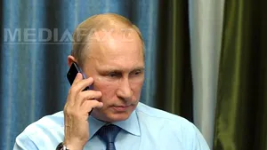 Putin şi Abbott discută despre 