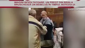 IMAGINILE ZILEI. Revoltător: Un preot din Brăila bruschează un bebeluş în timpul Botezului