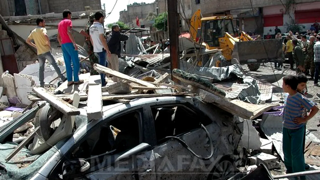 Cel puţin 100 de morţi într-un dublu atentat în oraşul sirian Homs - FOTO