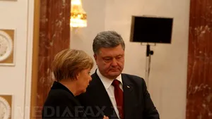 Angela Merkel: Putin a făcut presiuni asupra rebelilor pentru a accepta armistiţiul