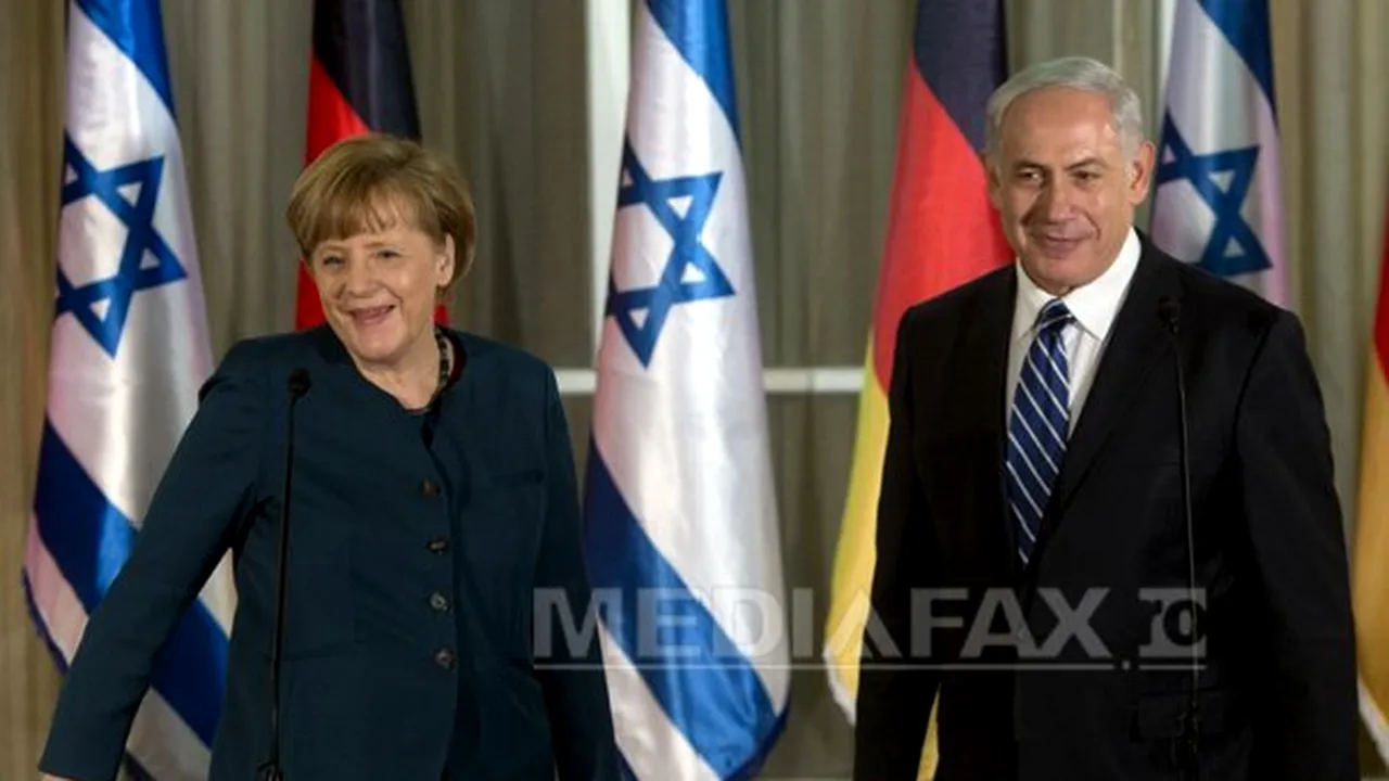 Angela Merkel, surprinsă într-o fotografie având pe faţă o umbră similară mustăţii lui Hitler - FOTO