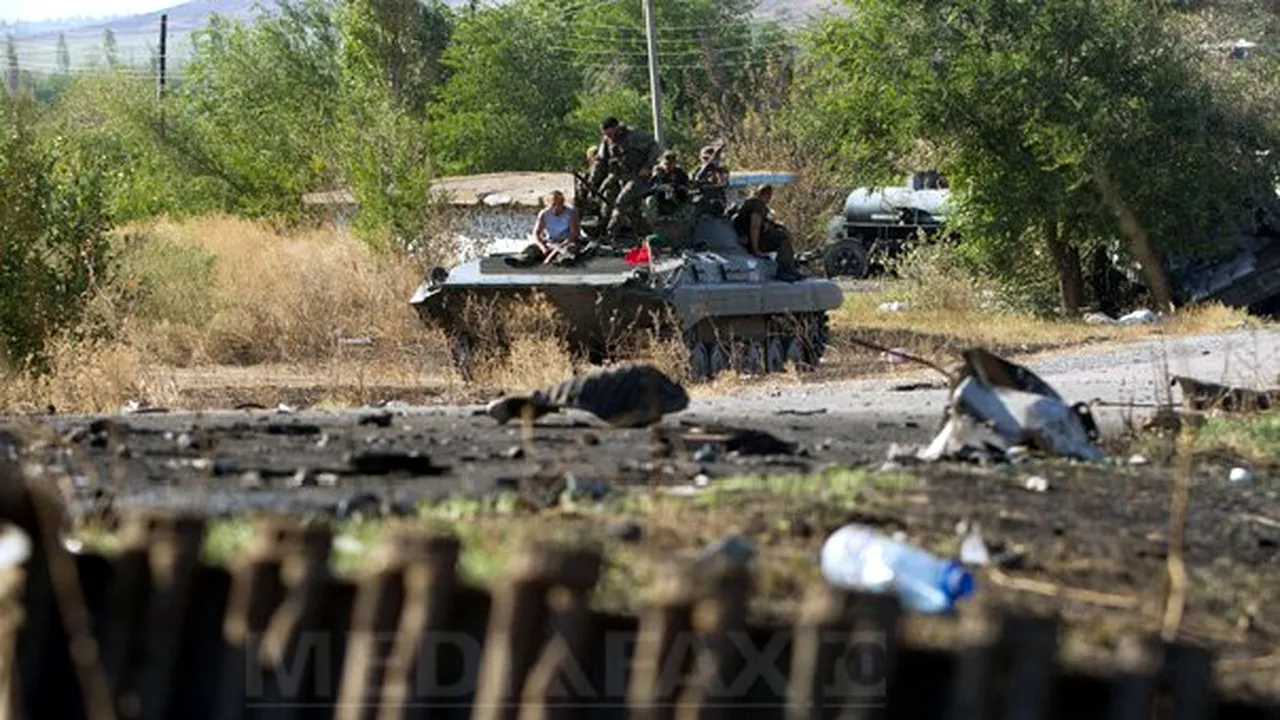 Kievul şi separatiştii proruşi au semnat un acord preliminar de ARMISTIŢIU. Poroşenko afirmă că împărtăşeşte cu Putin responsabilitatea ca armistiţiul să dureze