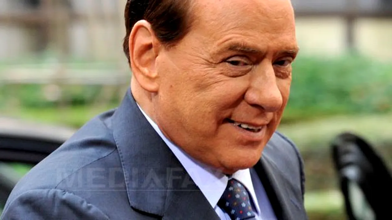 Berlusconi glumeşte după eşecul de la Milano, spunând că îşi pregătea înmormântarea, dar a amânat-o