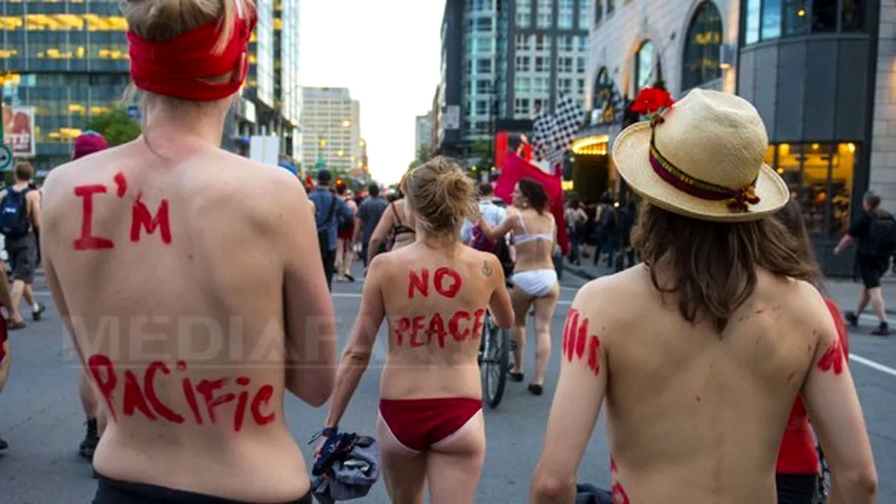 Proteste la Montreal: Mii de tineri, dintre care unii erau dezbrăcaţi aproape complet, au manifestat bătând în caserole - FOTO