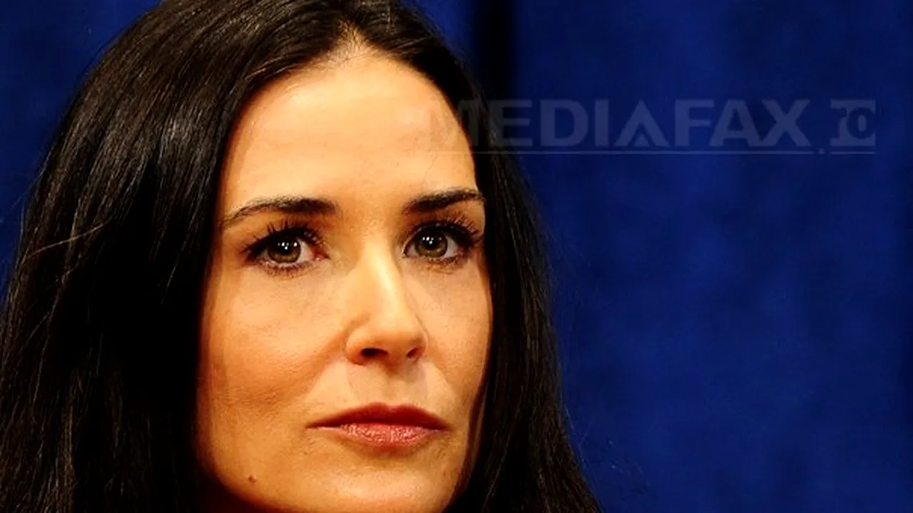 Demi Moore, acuzată că a lovit un fotograf