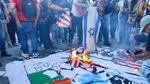 La o lună după cutremurul din Venezuela, manifestanții pro-Maduro incendiază steagurile SUA și Israelului