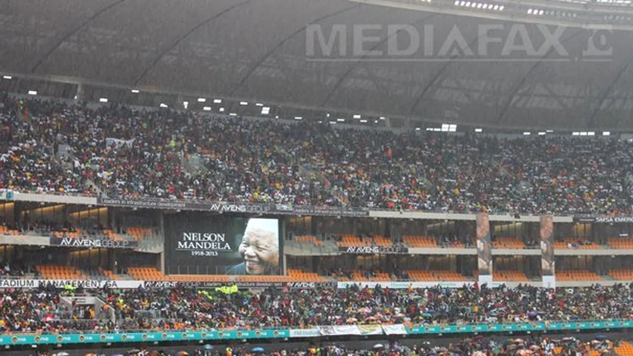 Corespondenţă din Johannesburg: Nelson Mandela, funeralii într-un oraş blocat de trafic şi ploaie şi printre scandări tribale - FOTO