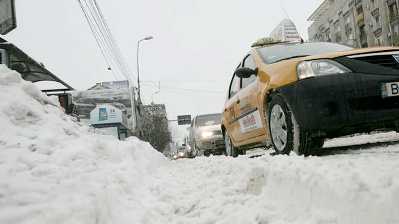 Firmele de taxi scot bani din zăpadă