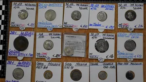 Doi indivizi sunt cercetaţi penal după ce au scos la vânzare pe internet 500 de monede antice şi medievale
