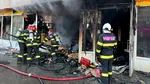 Incendiu într-un spațiu comercial de la parterul unui bloc din București