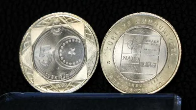 INEDIT Erdogan lansează „moneda NATO” de 5 lire, special pentru Summitul de la Ankara. 500.000 de monede, puse în circulație