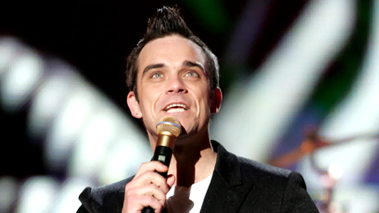 Robbie Williams revine pe scenă fără trupa Take That