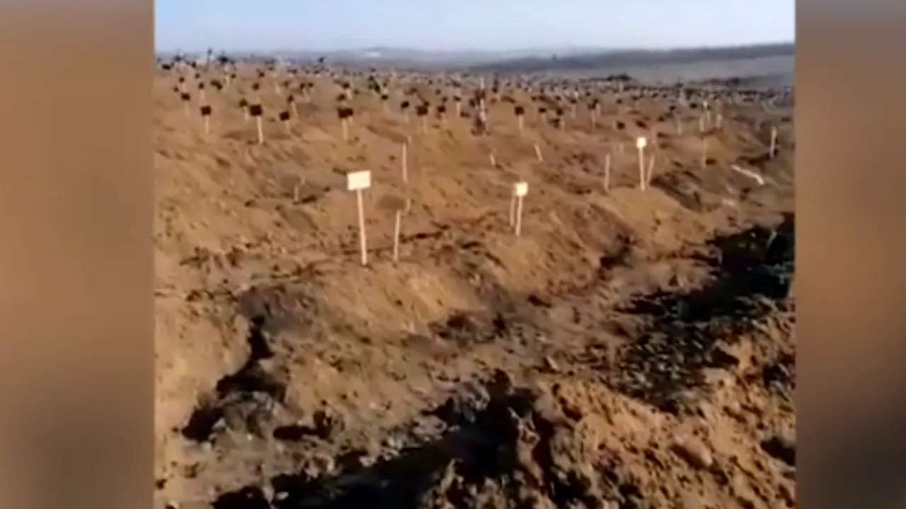La Mariupol, un deal este o întindere nesfârşită de morminte
