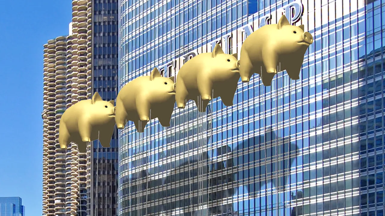 Numele lui Donald Trump de pe turnul său din New York, mascat de baloane în formă de porci zburători