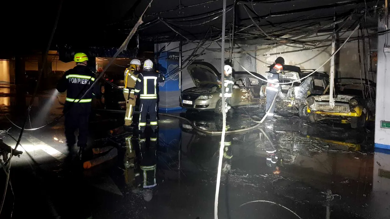 VIDEO | Incendiu într-un mall din Bucureşti: Patru persoane au ajuns la spital, iar trei maşini au fost distruse / Bilanţul ISU